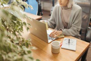 image shows woman working with contract management