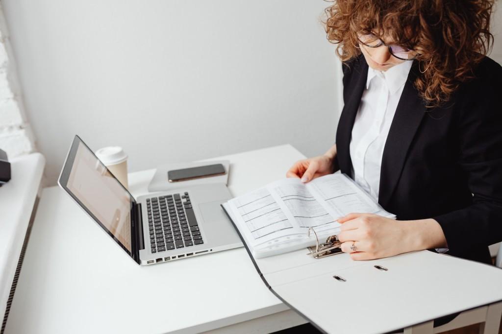 image shows woman trying to figure out contract management software