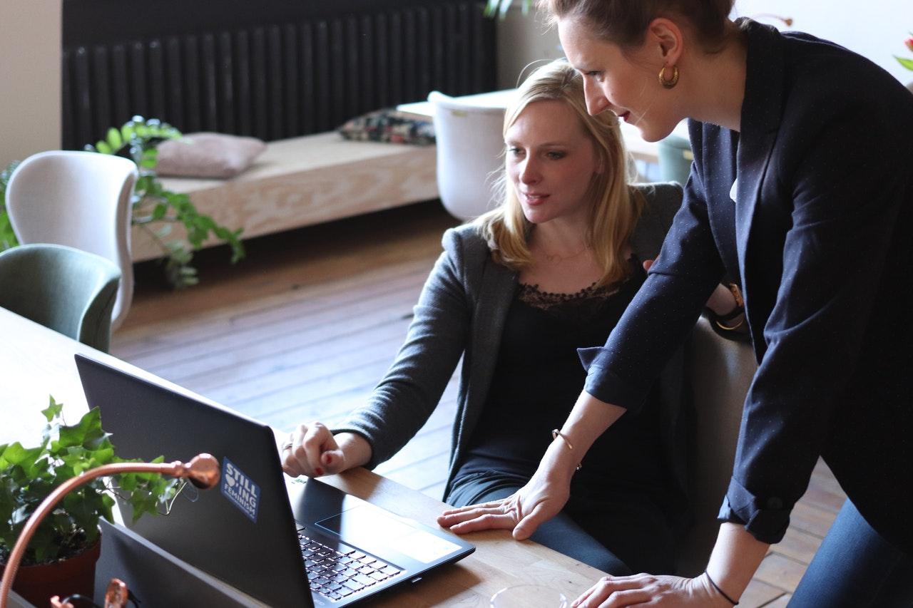 image shows coworkers collaborating on contract