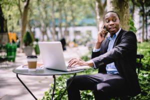 image shows man making contract deal over phone